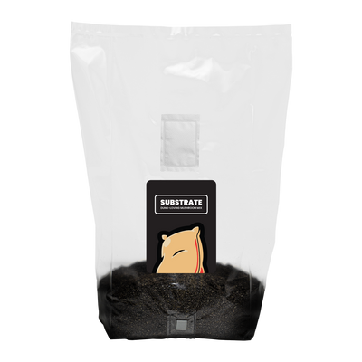 A sealed clear plastic bag containing dark, rich substrate with a label reading "SUBSTRATE" and a mycelium graphic.