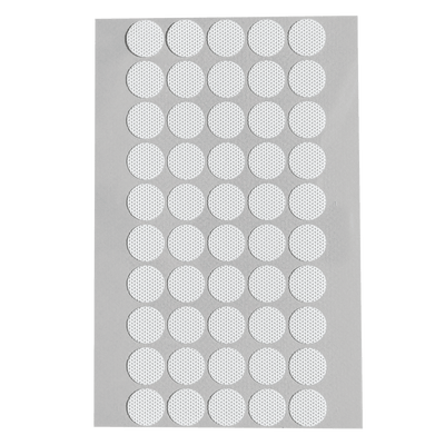 A close-up of a full sheet of Microppose adhesive jar filters, each white with a central mesh for air exchange, on a light background.