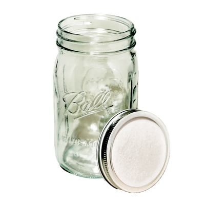 A clear glass Ball jar with a white Microppose synthetic filter lid on top, designed for mycology applications, against a dark background.