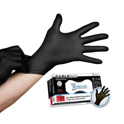 A person putting on black nitrile gloves . Small image of box of gloves in background.