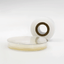 Microppose laboratory polyfilm roll resting next to a petri dish, highlighting the product's clarity and the sterile mycology environment it's used in.