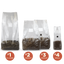 A lineup of clear mushroom grow bags with filter patches and injection ports filled with substrate and grain as a size comparison.